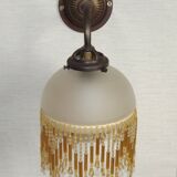 French vintage bronze effect single wall light with opaque beaded glass shade.