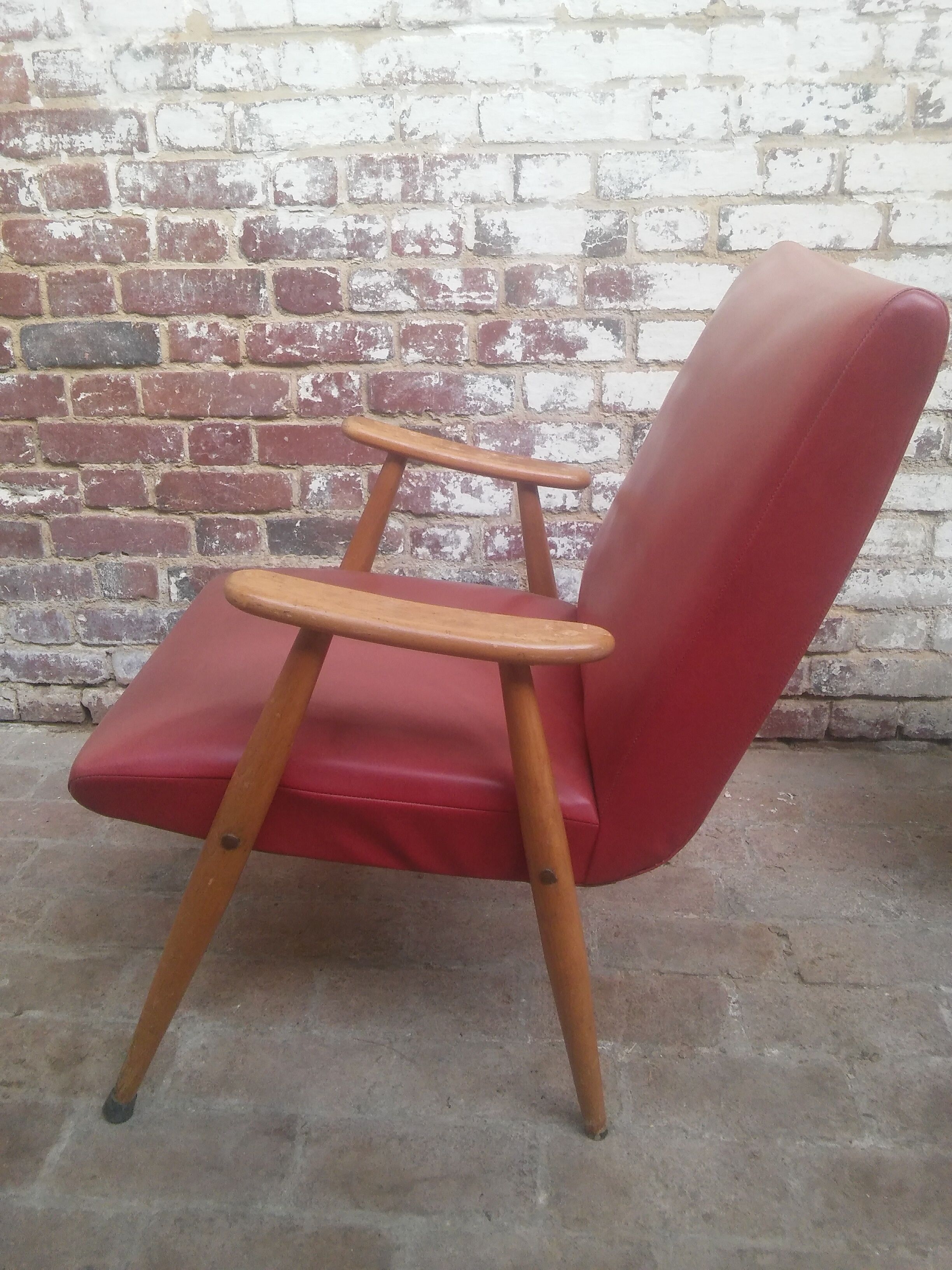 Red armchair with compass feet 50s