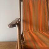 Old foldable beach seat in wood and canvas for children