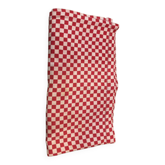 Old tablecloth in red white checkerboard with daylight
