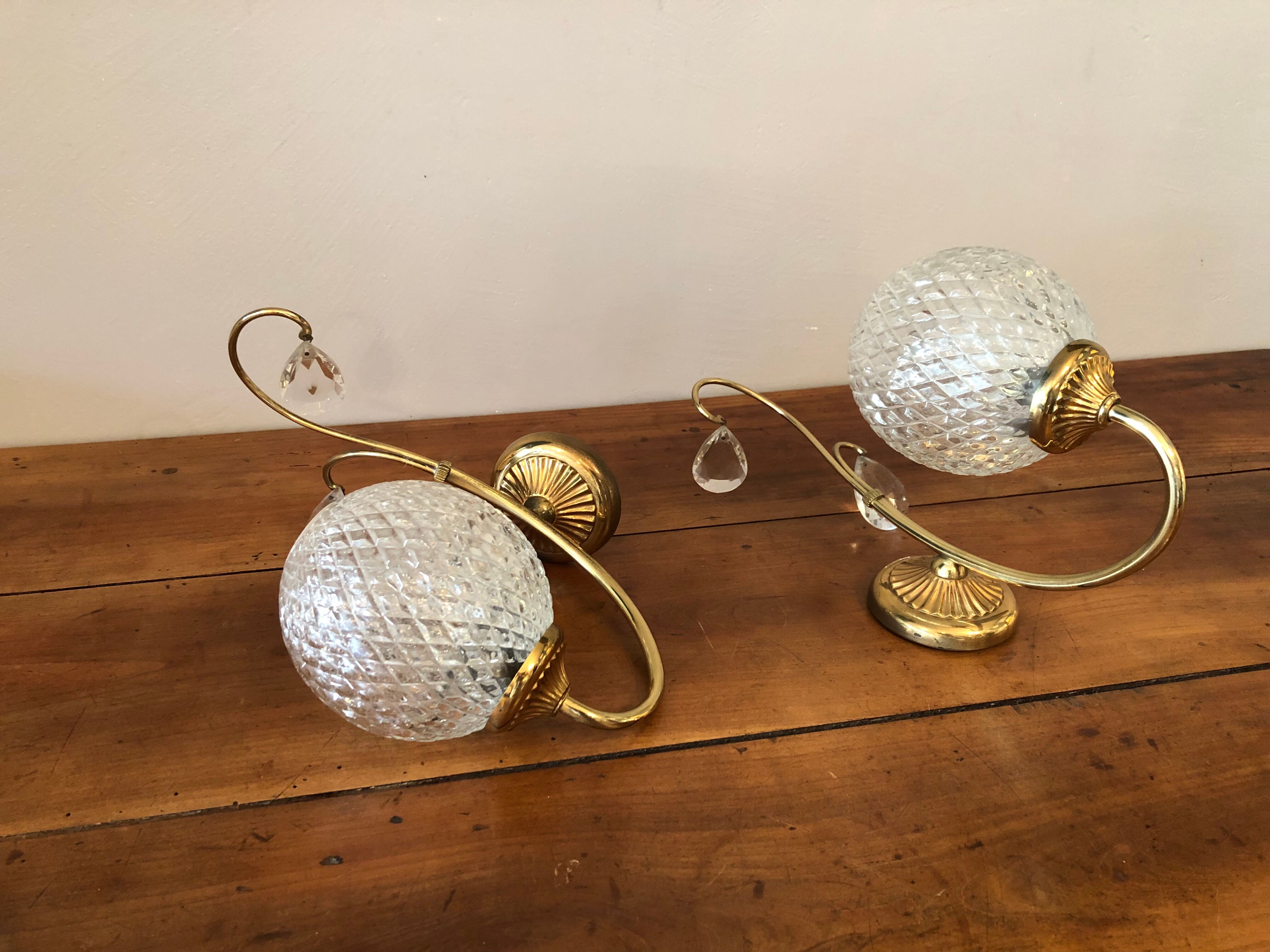 Duo of brass and glass wall lamps