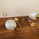 Duo of brass and glass wall lamps