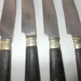 Set of 11 black wooden sleeve knives
