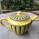 Teapot in yellow and black porcelain stamped Sarreguemines