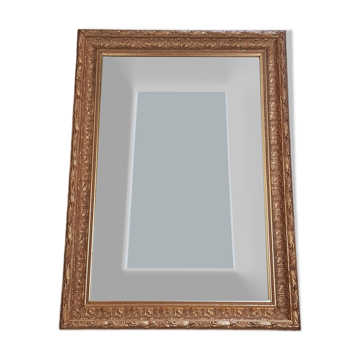 Mirror in gilded stucco wood and beveled glass