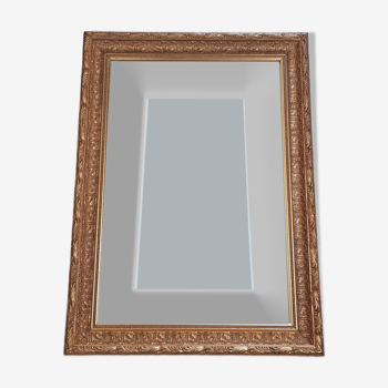 Miroir en bois stuc doré et verre biseauté