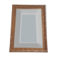 Miroir en bois stuc doré et verre biseauté