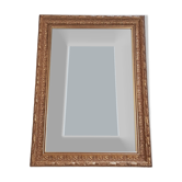 Mirror in gilded stucco wood and beveled glass