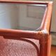 Varnished rattan coffee table and smoked glass top