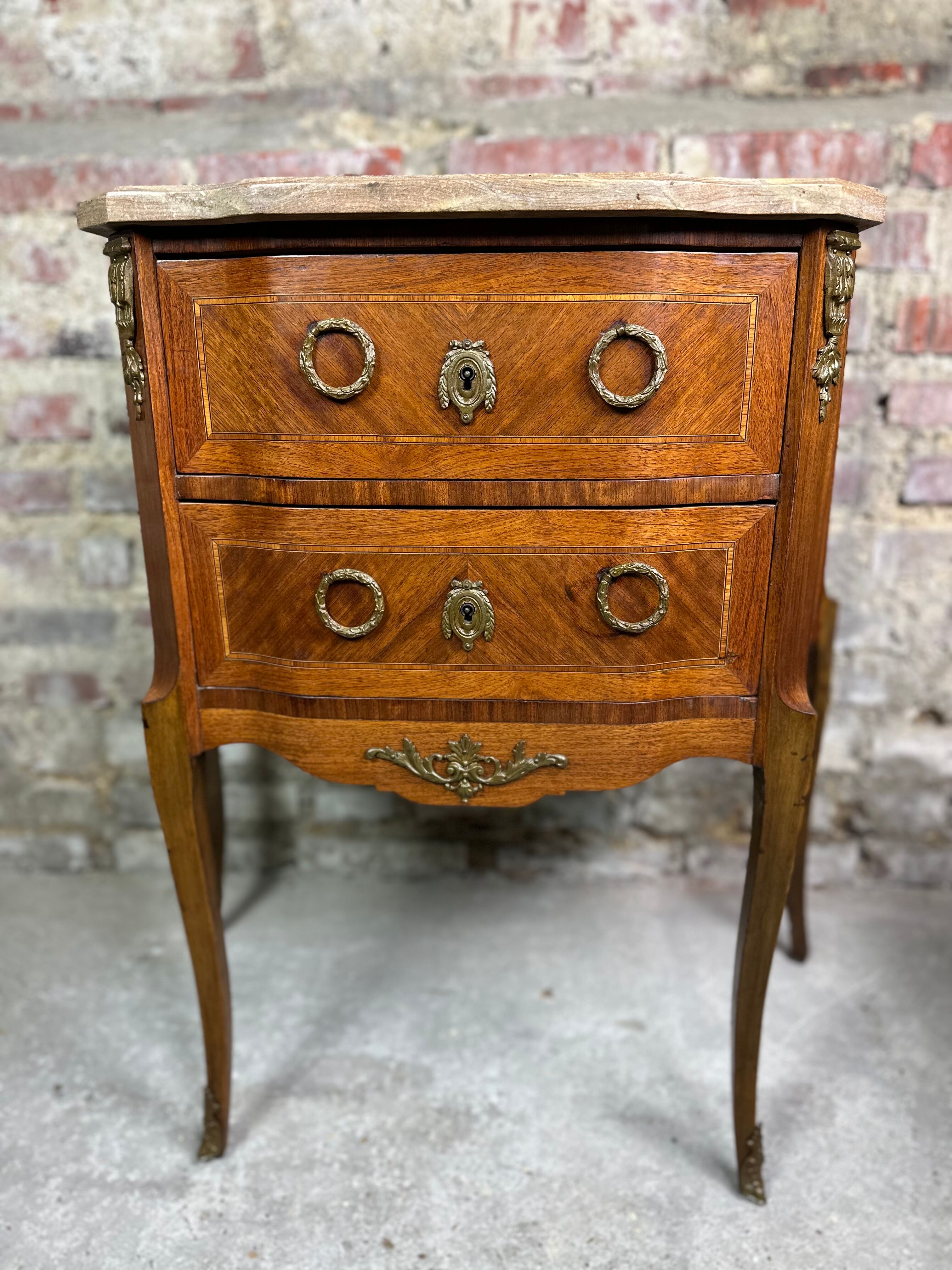 Louis XV/XVI transition style curved chest of drawers in marquetry and bronze