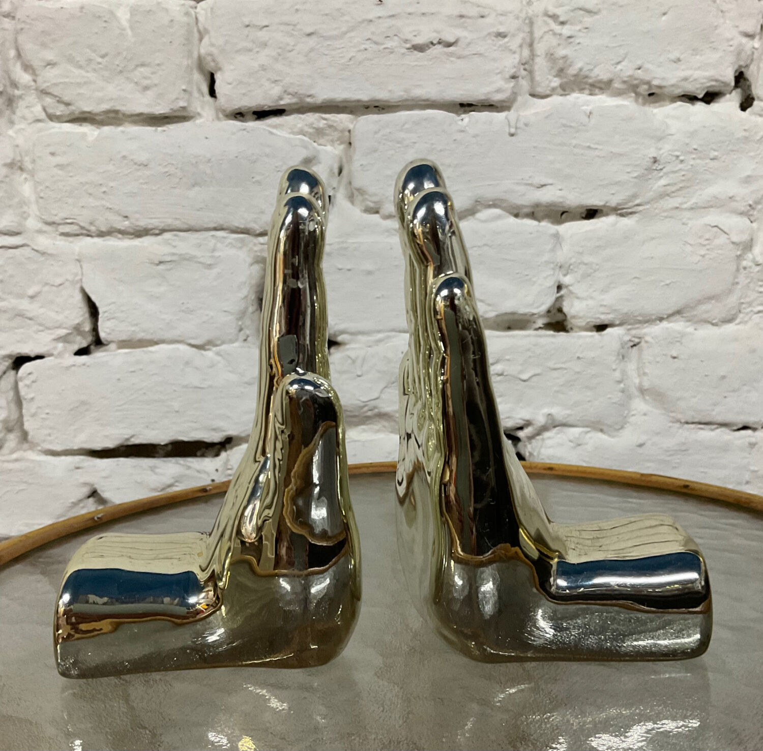Pair of chrome ceramic hand bookends from the 70s and 80s