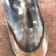 Polished beef horn on brass base