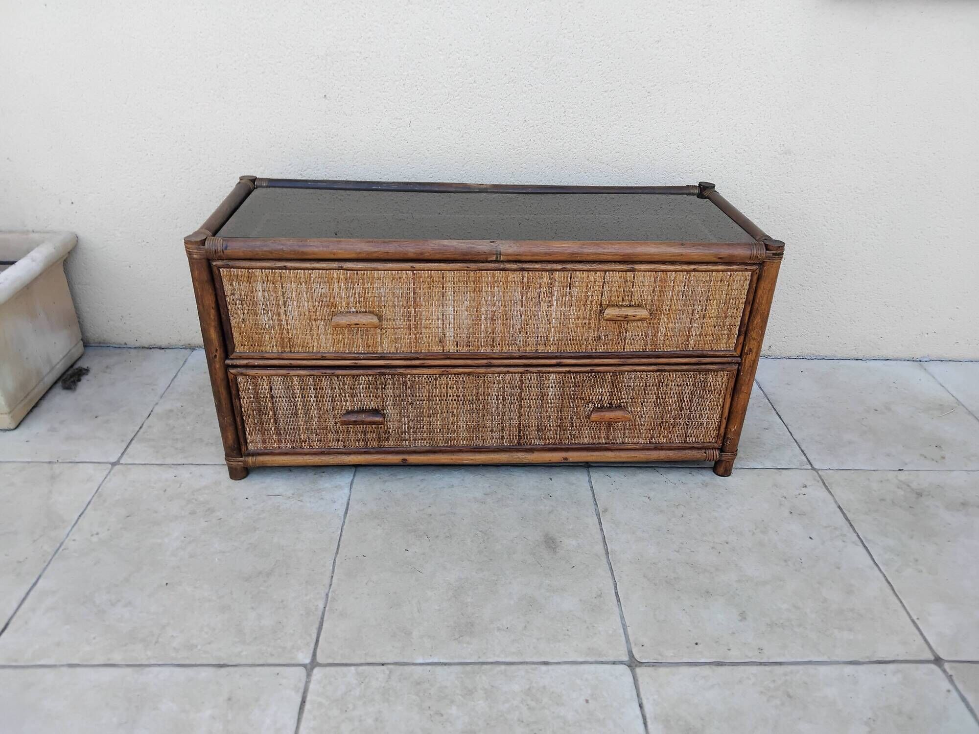 Vintage rattan and glass TV unit.