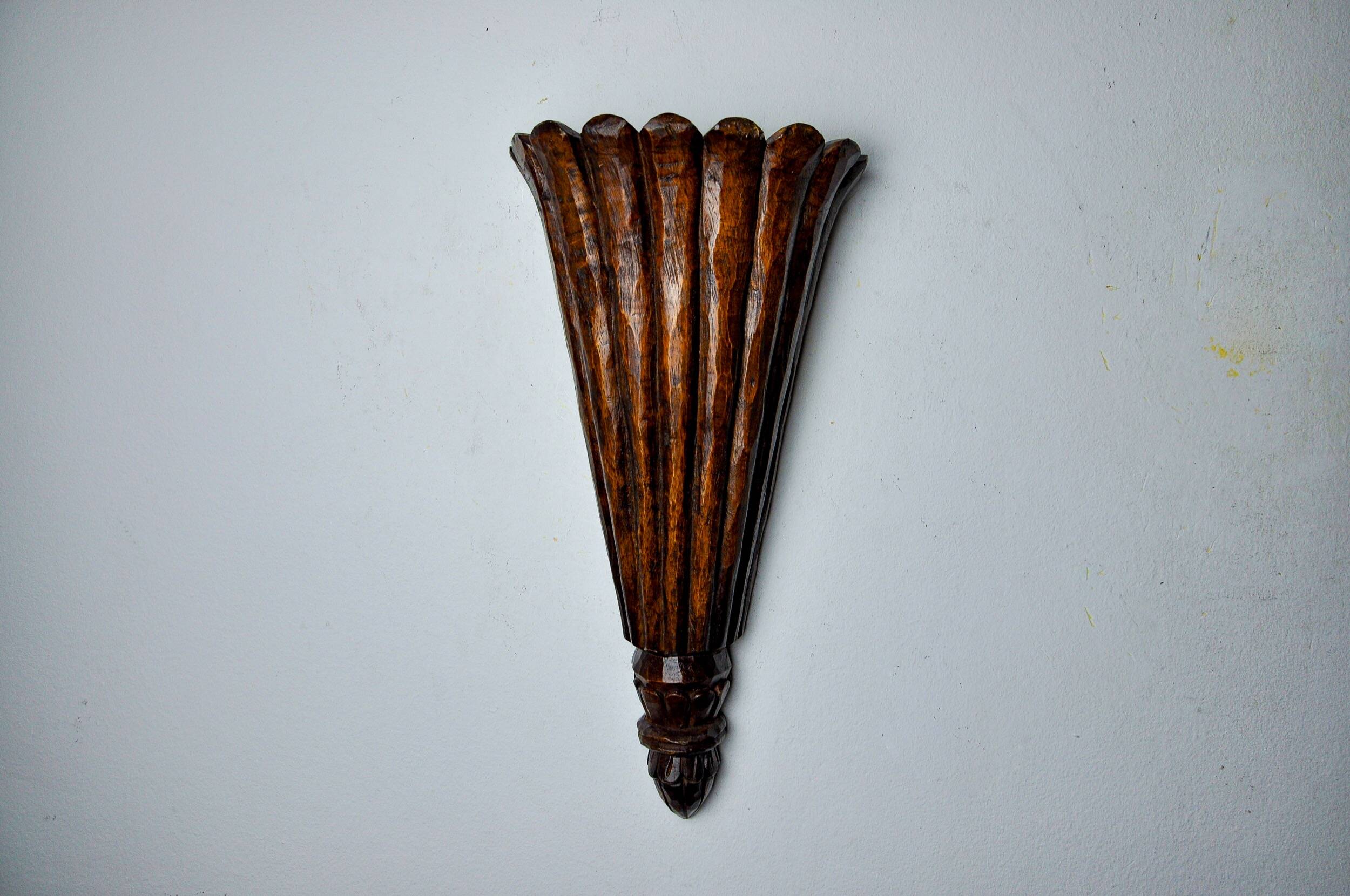 Art Deco wall light in carved wood, France, 1930