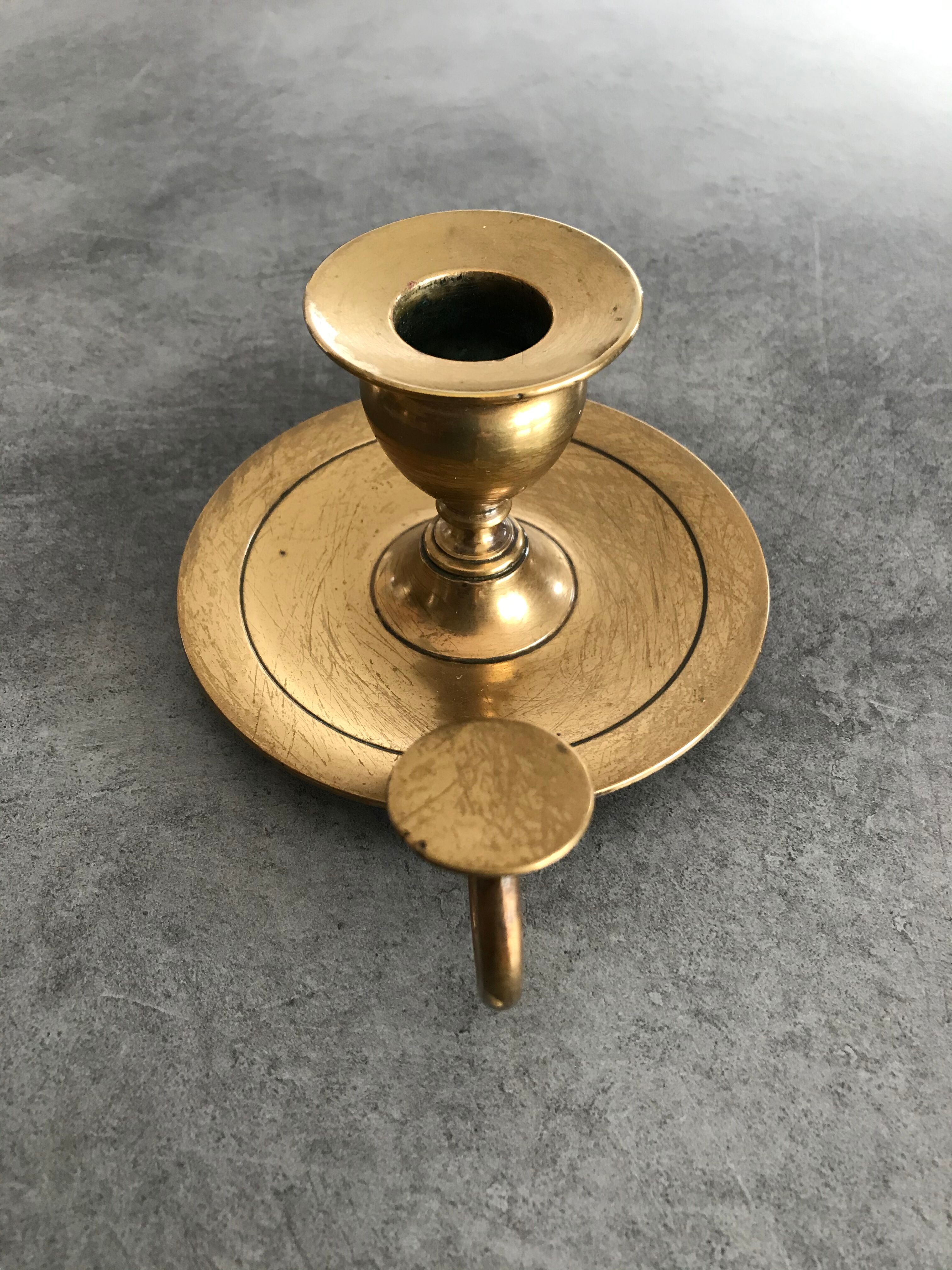 Hand candlestick in massive brasse