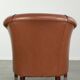 Cowhide club armchair in English style with comfortable seating.