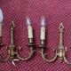 two brass wall sconces