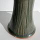 Dark green handcrafted vase with glazed ceramic grass blades