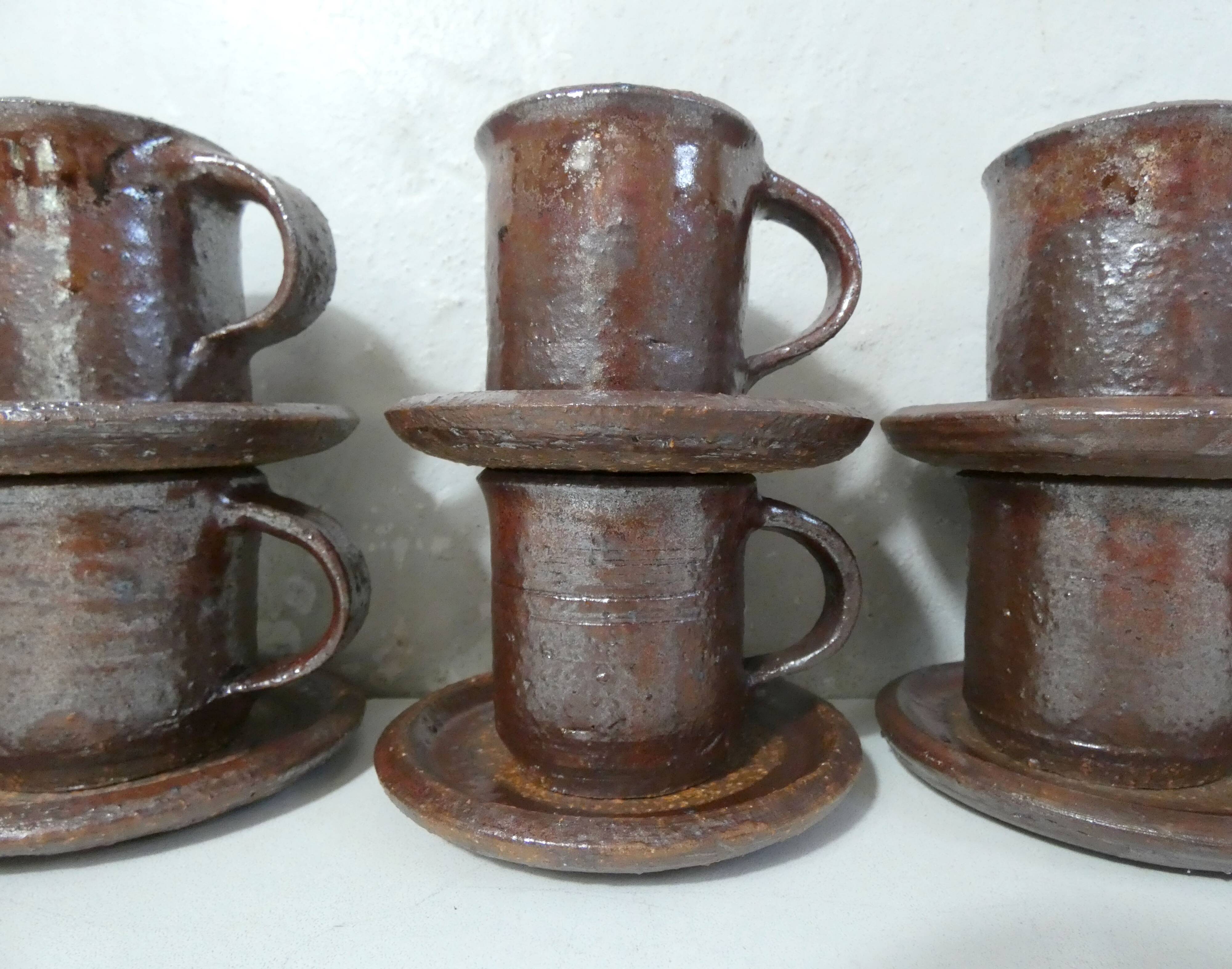 coffee service in iridescent stoneware cups and vintage sugar bowl