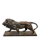 Bronze lion in motion with a brown patina, signed barye.