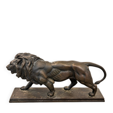 Bronze lion in motion with a brown patina, signed barye.