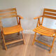 Paire de fauteuils pliants en bois vernis signé Clairitex