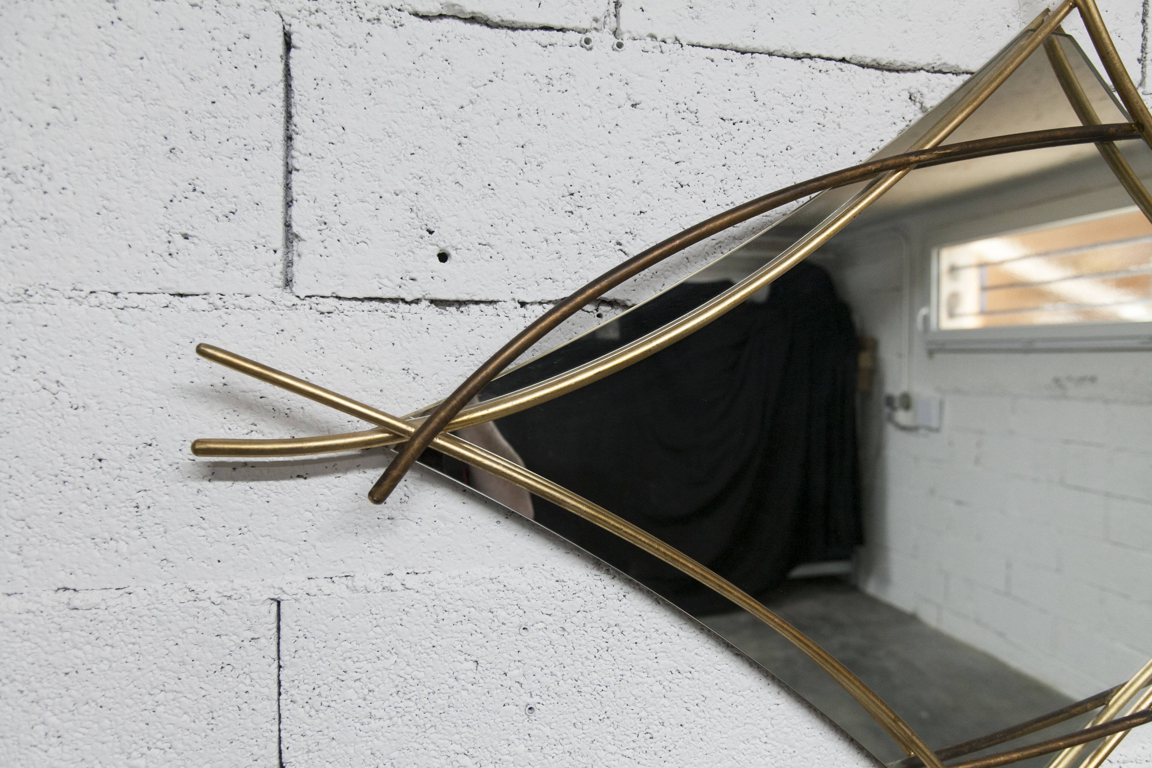 Sculptural mirror with two-tone gilded arches, France, 1970s, 95 x 133 cm