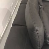 2 black leather sofas roche bobois scenario, one three-seater and one chaise longue.