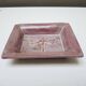 Old purple ceramic ashtray with dragonfly decoration.
