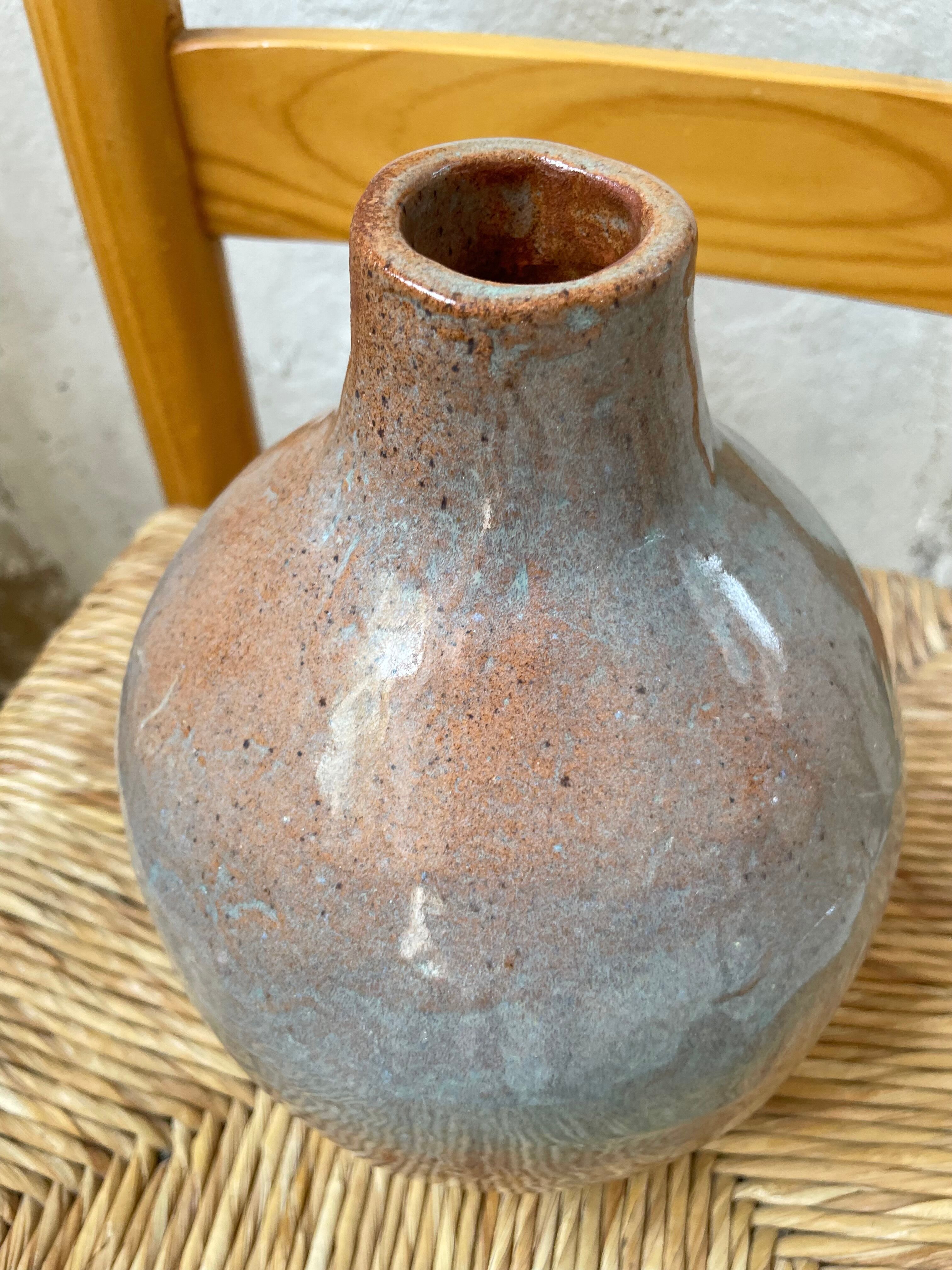 Glazed earth vase signed