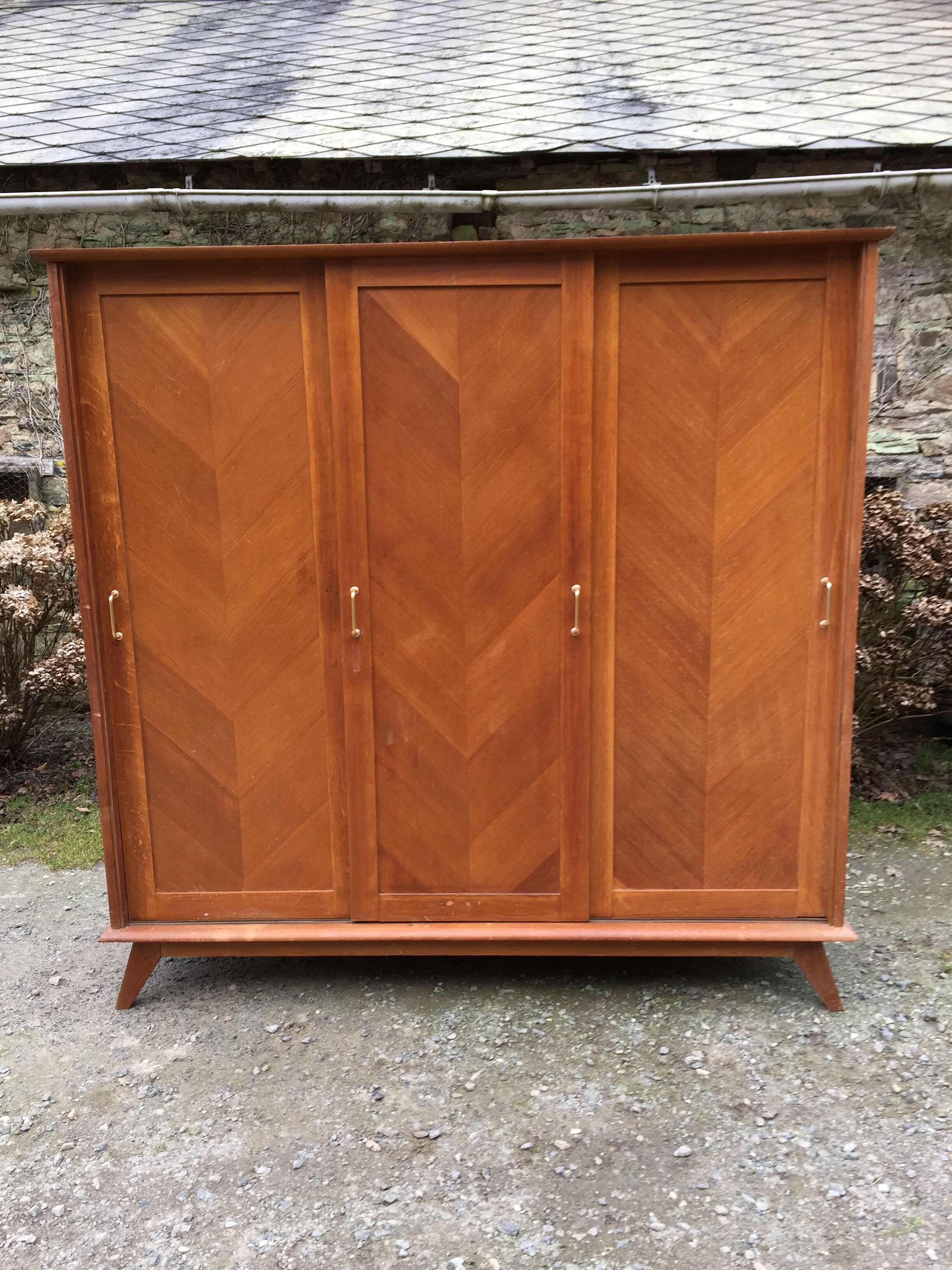 Vintage wardrobe compass feet with 3 sliding oak doors.