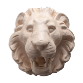 Lion's head in painted plaster