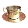 Silver metal cup and saucer