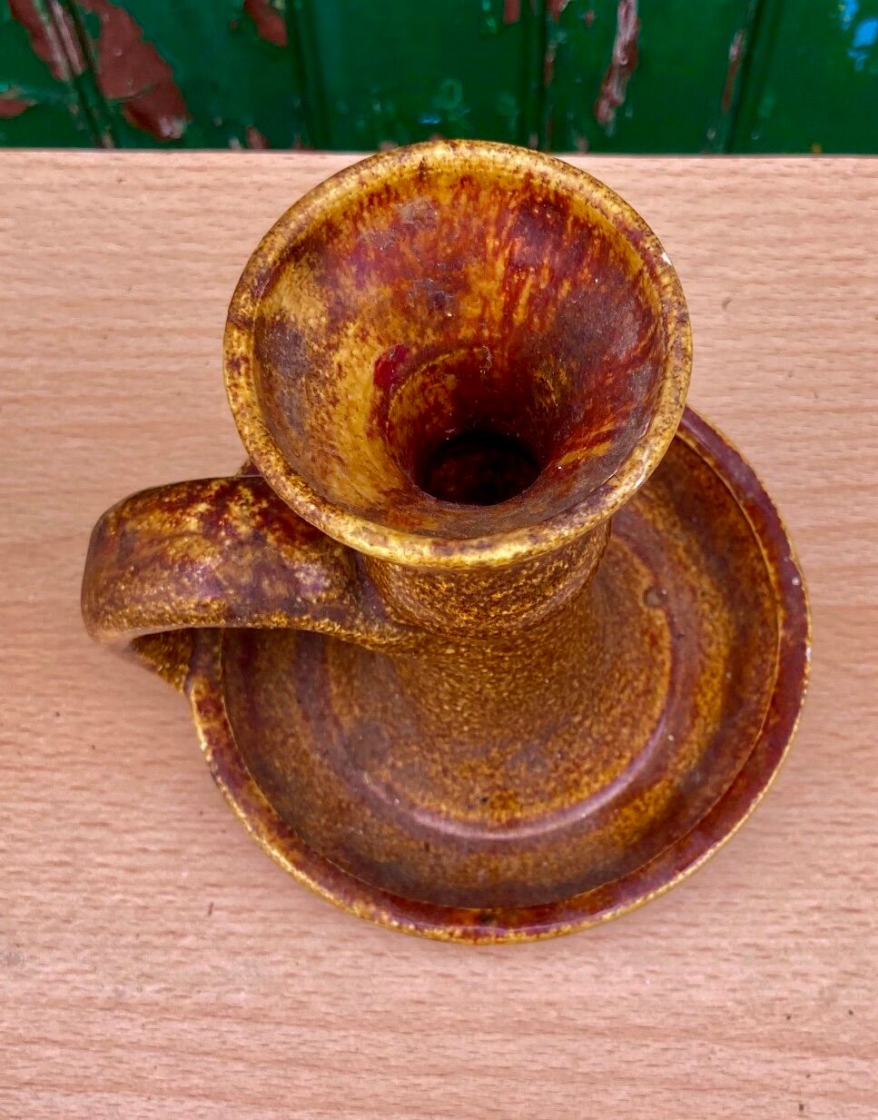 Candle holder in old earthenware signed by the 2 glued aa of the Accolay factory