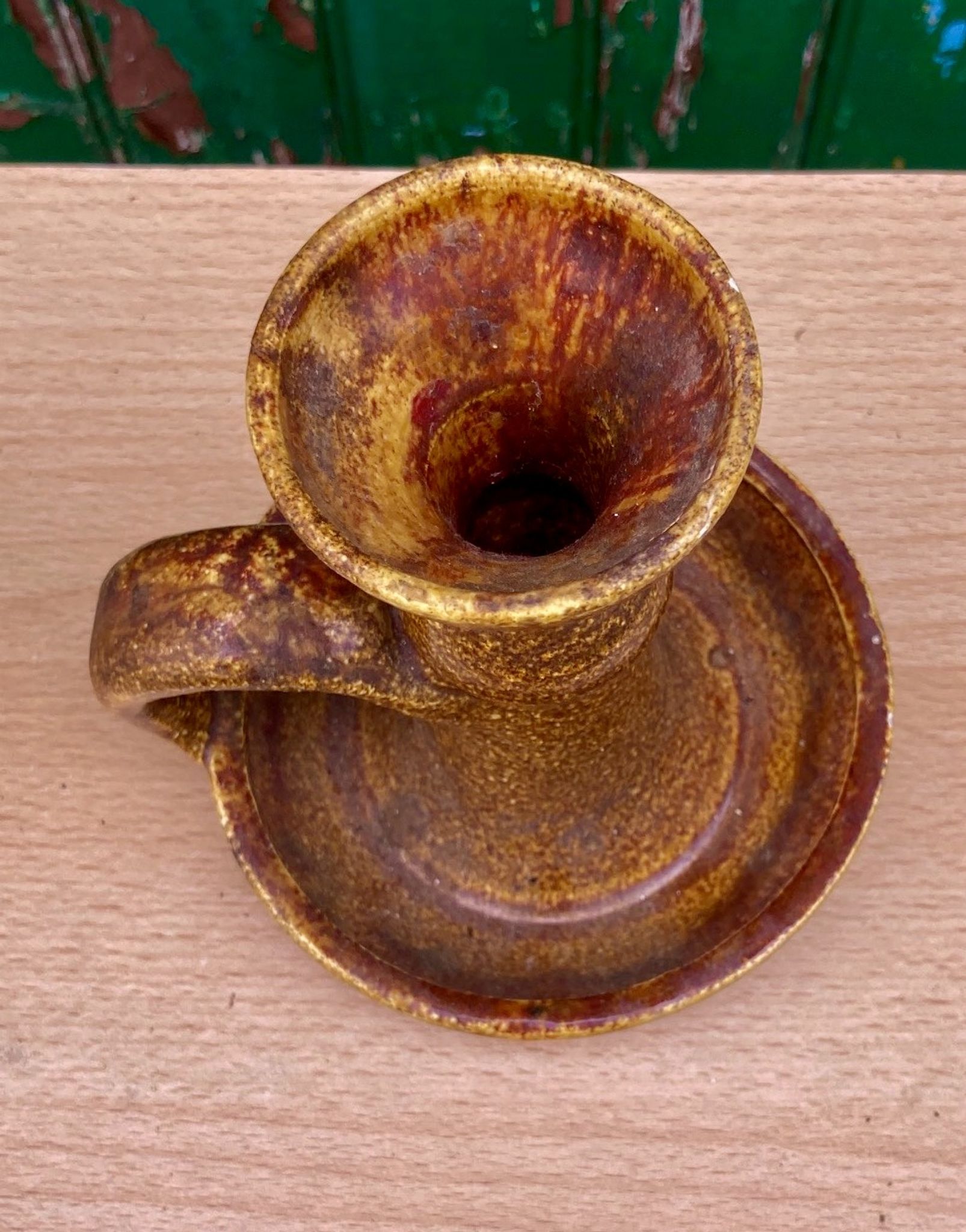 Candle holder in old earthenware signed by the 2 glued aa of the Accolay factory