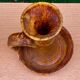 Candle holder in old earthenware signed by the 2 glued aa of the Accolay factory