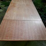 wooden dining table with compass legs and extensions