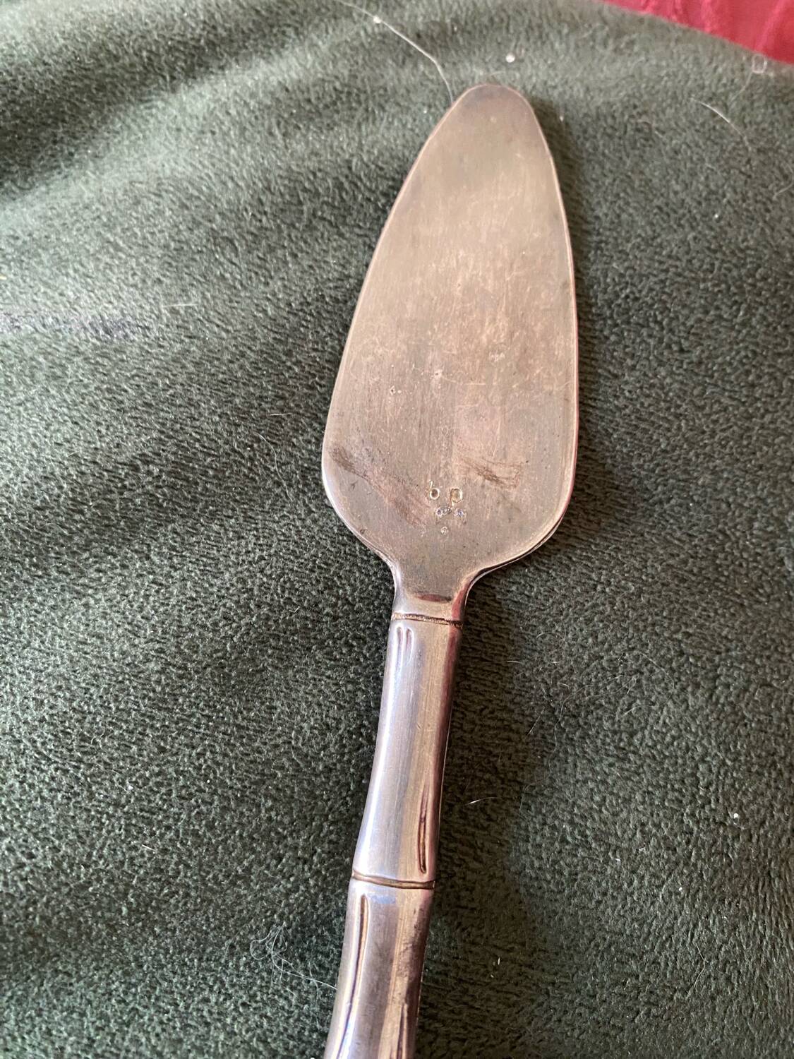 Cheese cutlery with silver-plated bamboo handle.