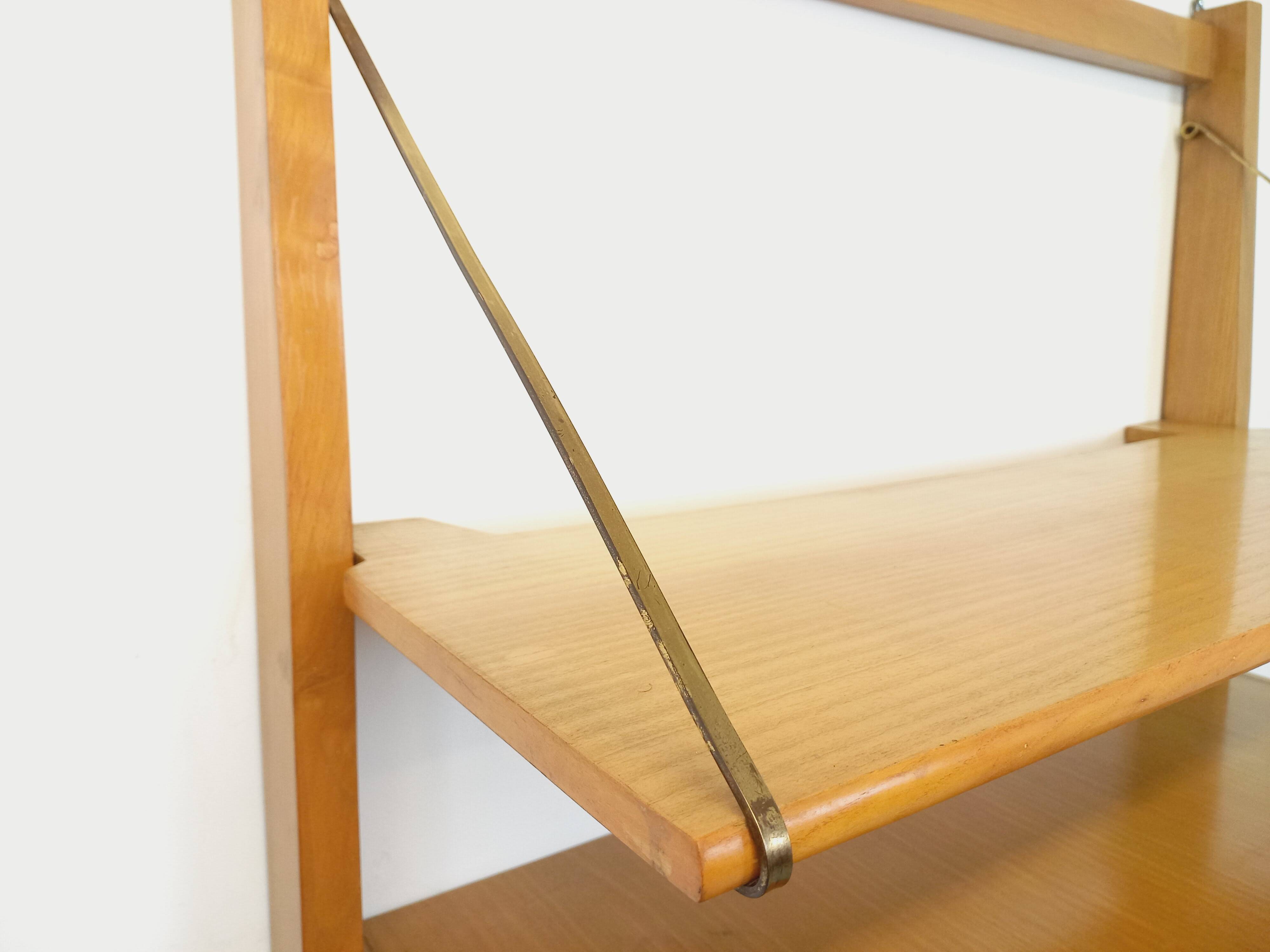 Wall shelf library with vintage light wood secretary bar