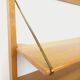 Wall shelf library with vintage light wood secretary bar