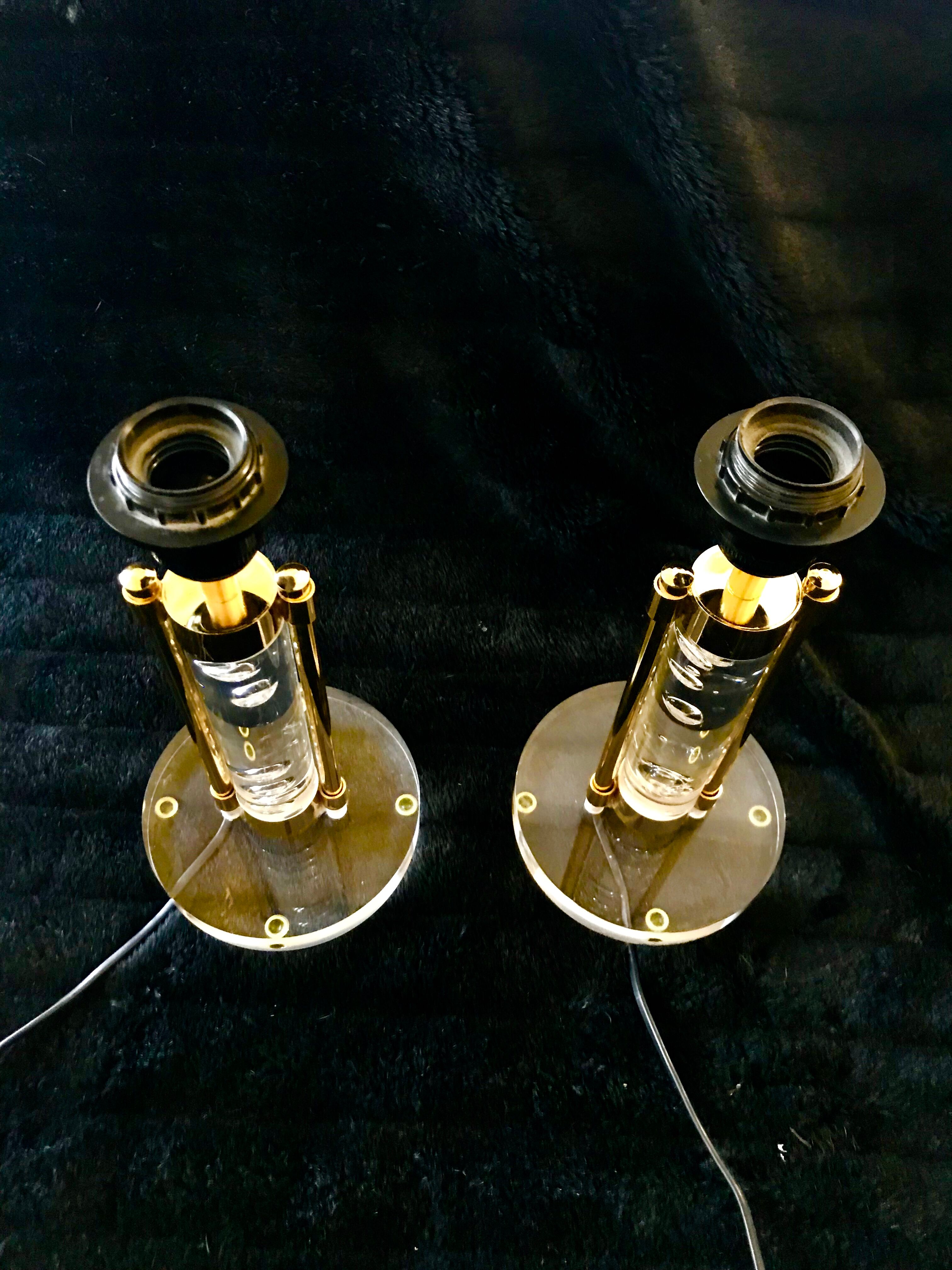 Pair of metacrilic lamps and gold structure