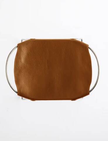 5 contemporary sculptural bar stools in metal, brass, and tobacco leather.