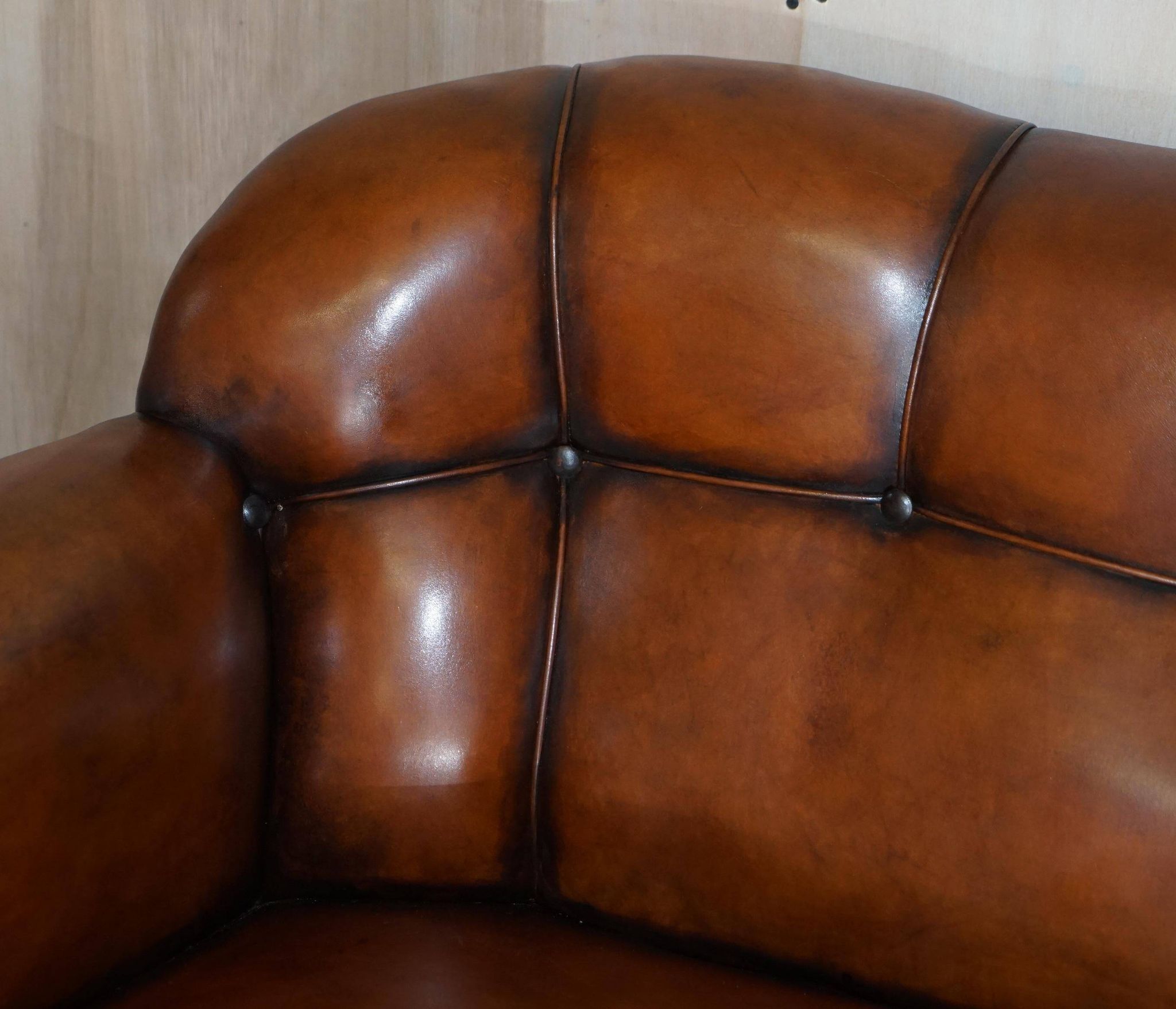 Victorian Chesterfield leather canapé with oak lion claw feet.