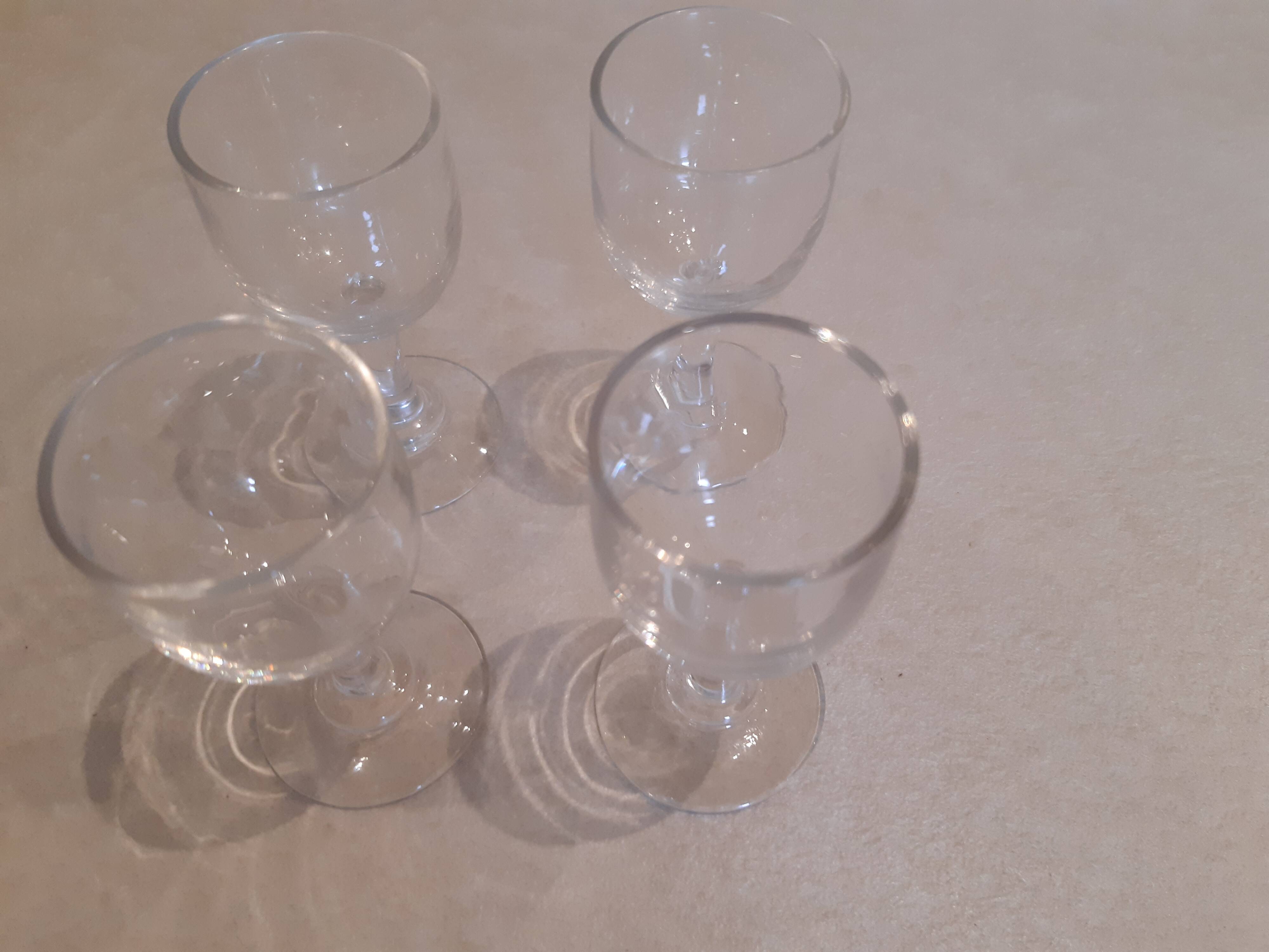 Set of 4 small stemmed glasses for strong alcohol.
