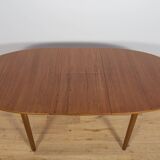 Mid-century extendable oval teak dining table from McIntosh, UK