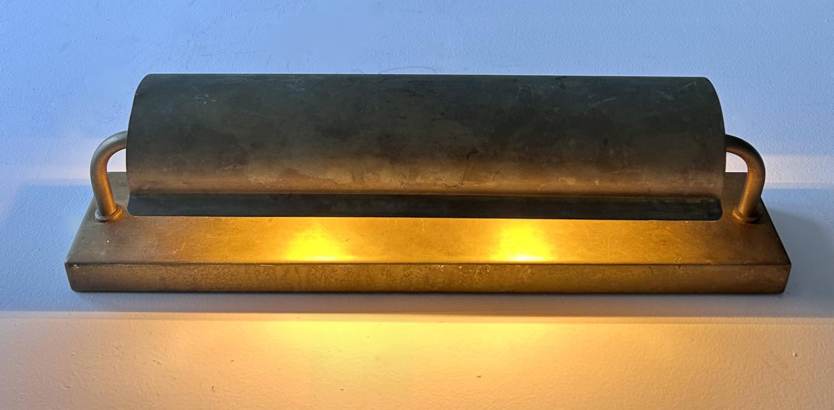 Modernist solid brass wall light, France 1940
