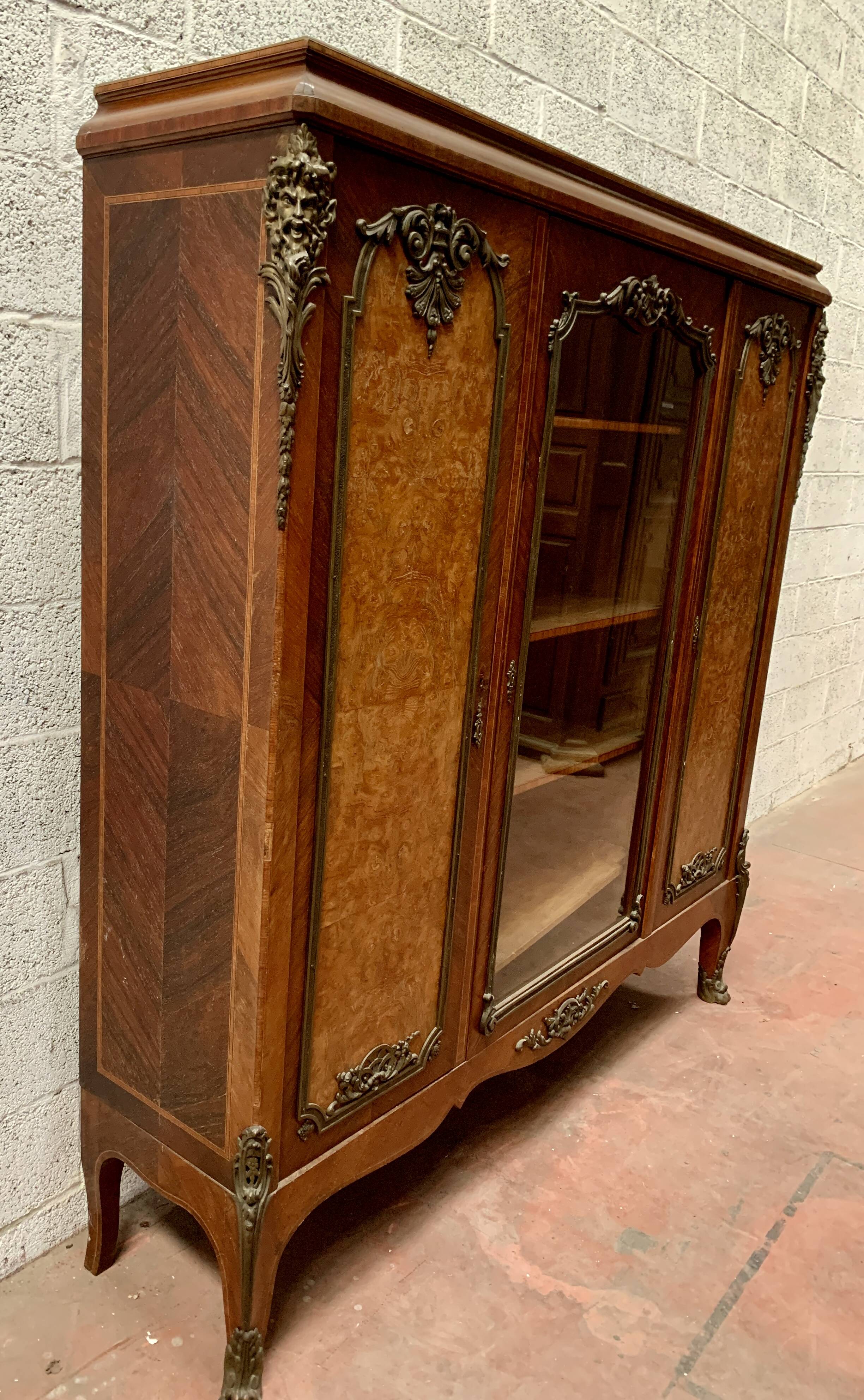 Louis XV style bookcase in mahogany and burr walnut, 20th century