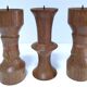 Three vintage patinated solid wood candlesticks