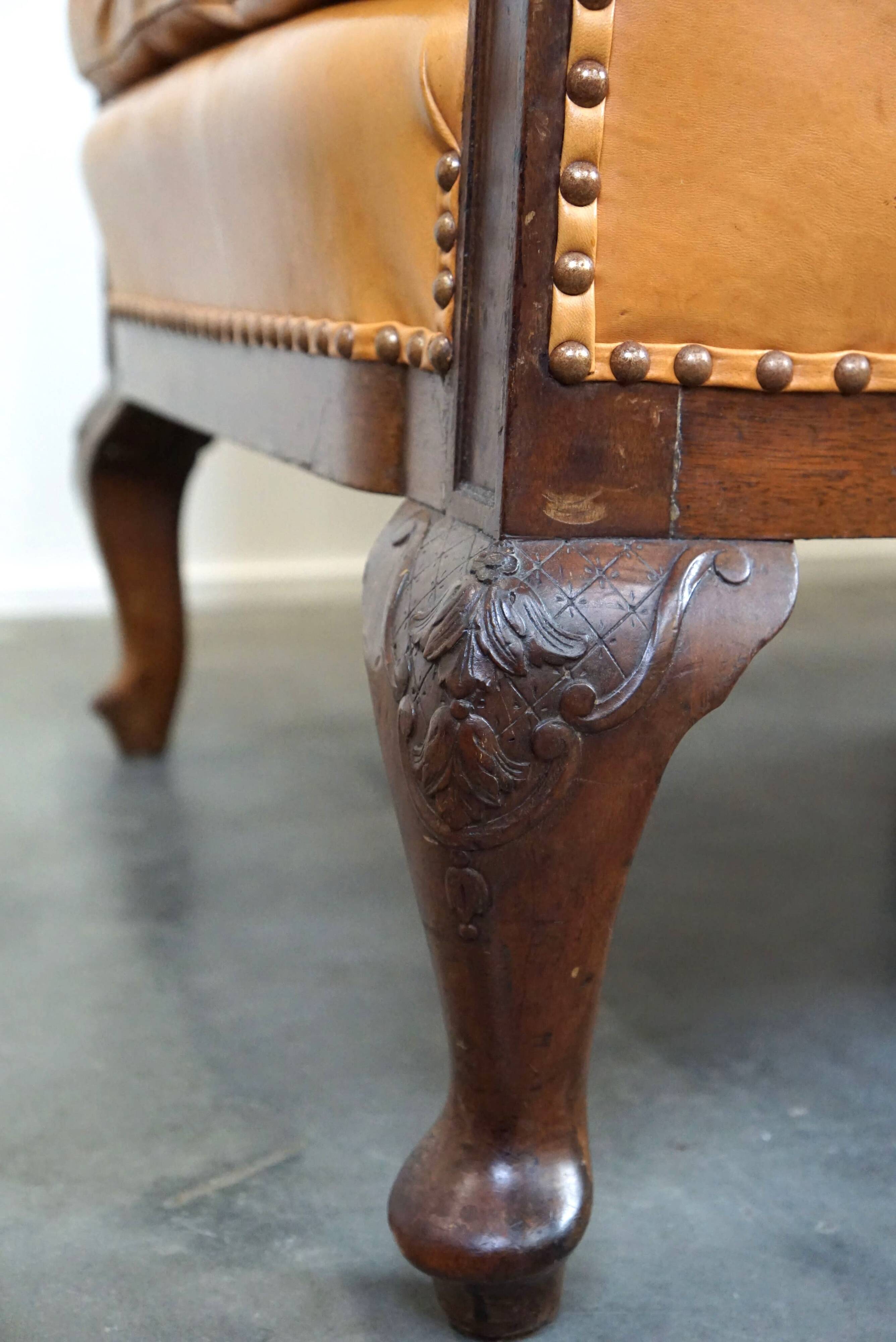 Unique old set of 2 club armchairs and a couch in cognac-colored leather with wheels