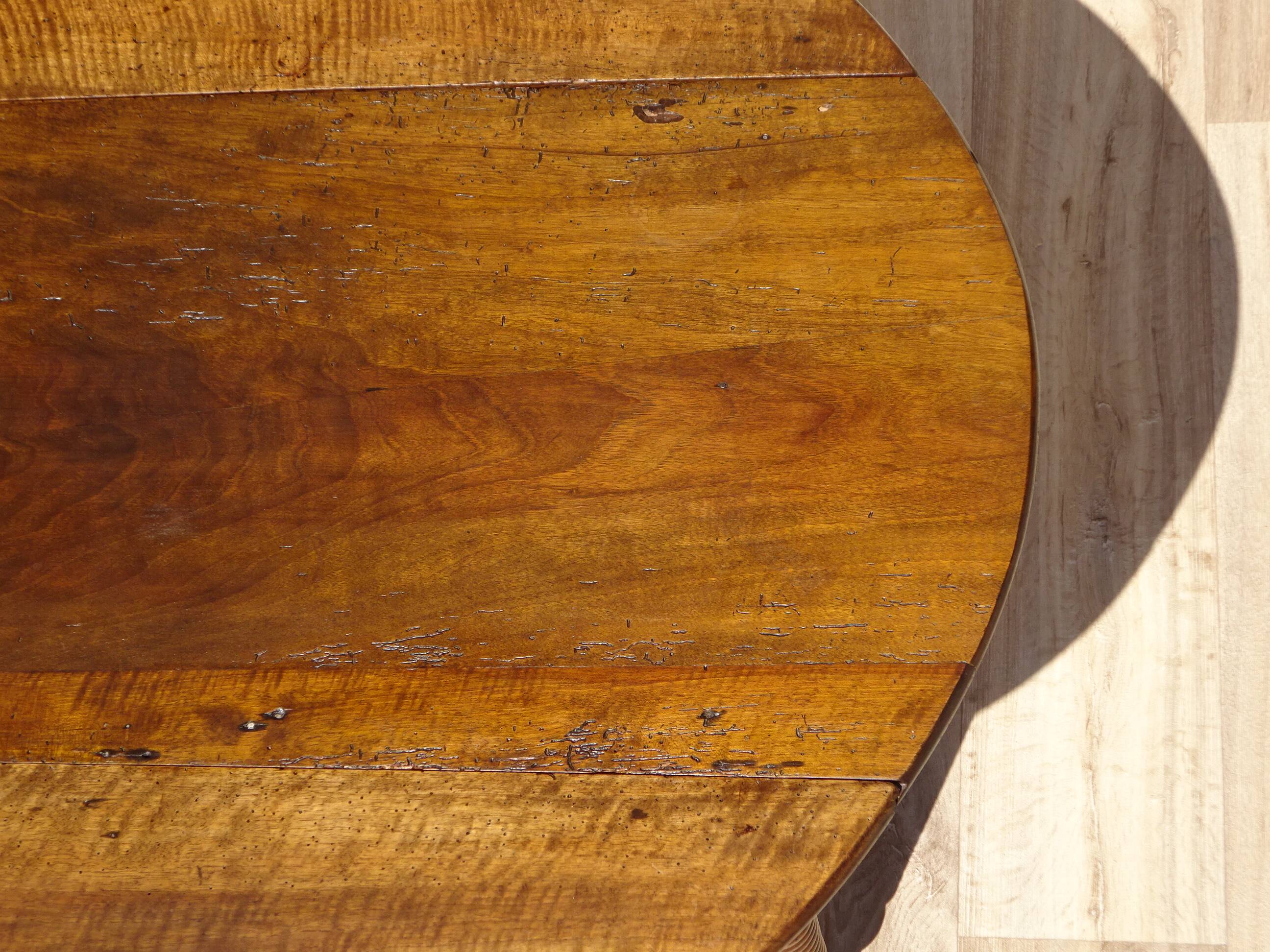 Antique walnut console table with honey spoon legs.